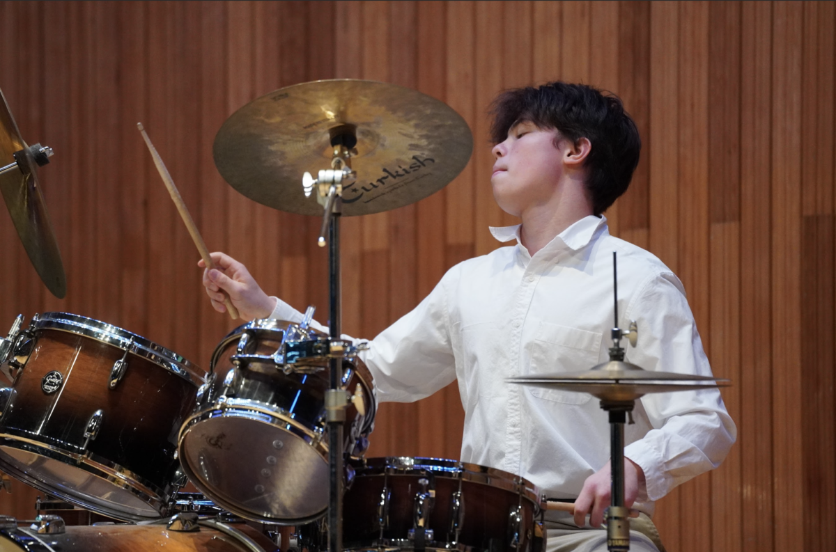 Freshman Sahn Choi revels in the power of the open cymbal as "surf" by wave to earth reaches its climax. His drumming brings the chill song to life. 